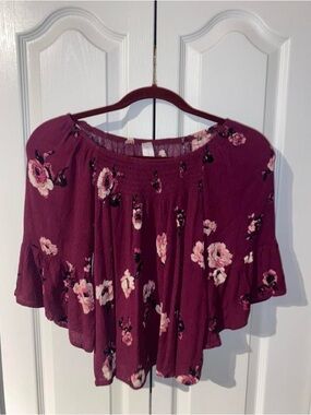 No Boundaries Burgundy Floral Off-Shoulder Blouse is a Women’s Size M(7-9).